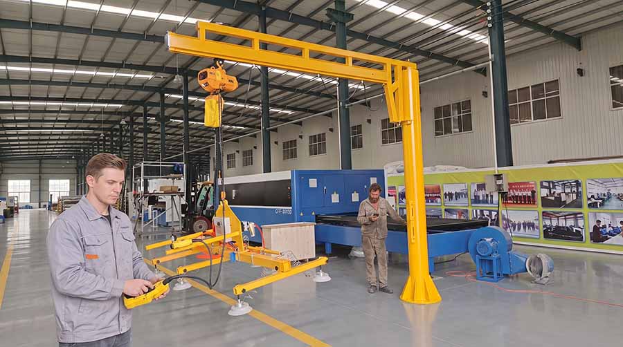 Industrial jib crane lifting maximum rated load at the outer boom position during deflection and load testing Industrial jib crane lifting maximum rated load at the outer boom position during deflection and load testing